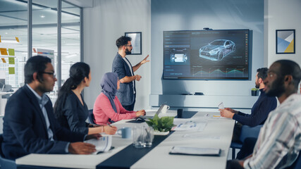 Multi-Ethnic Office Conference Room Meeting: Hispanic Industrial Engineer Presents Car Concept to a...