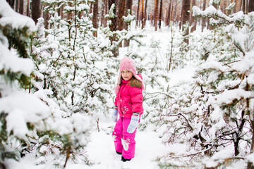 girl playing with snow