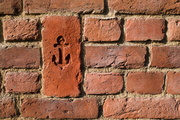 Anchor symbol on brick . Navy concept