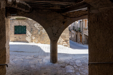 arcaded street in the town of Guimera in Catalonia