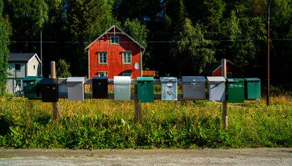 Row of post boxes in a rural area in Norway
