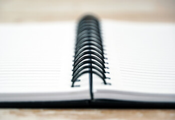 Spiral of notepad close-up. Selective focus on foreground.                                              