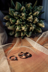 Wedding rings on the table. Wedding details for the ceremony.