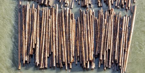 Logs pulled by a tugboat on Fraser River. Aerial View from Port Mann Bridge in Greater Vancouver,...