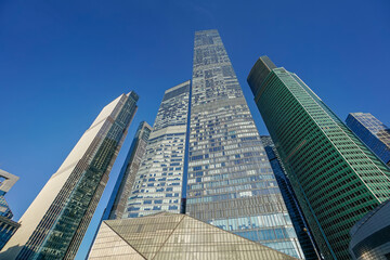 Fototapeta na wymiar Skyscrapers in the business center, financial district, sunny day, blue sky, empty space, Moscow city, Russia.