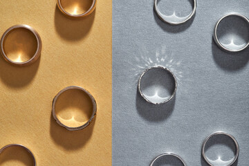 Gold and silver engagement rings lying flat