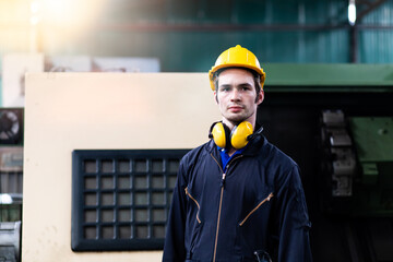 Man Worker at industrial factory wearing uniform and hard hats. Engineering and architecture concept