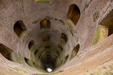 Looking down St. Patrick's Well, built in the 16th century and 74 meters deep with two staircases, in Orvieto, a hill town in the Tuscany region of Italy.
