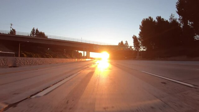 Sunrise driving on 210 freeway east near the Glendale freeway in Los Angeles County, California.