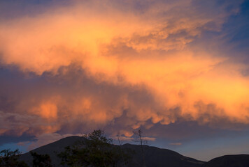 A huge mammatus cumulus cloud floating over the Iguaque mountain at sunset, near the colonial town of Villa de Leyva in central Colombia.