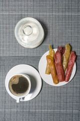 Coffee, fruit candy and sugar, photo on the table
