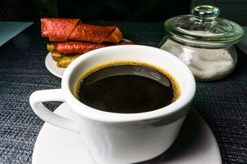 Coffee, fruit candy and sugar, photo on the table