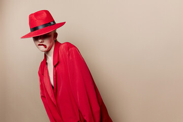 glamorous woman red jacket and hat red lips fashion isolated background