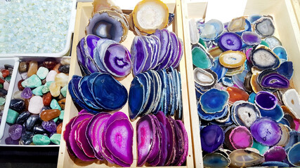 Beautiful cross section of  blue agate , green malachite and purple agate crystal geode . Natural translucent slice geode crystal surface 