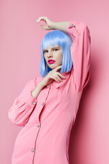 portrait of a woman in blue wig pink dress red lips Lifestyle posing