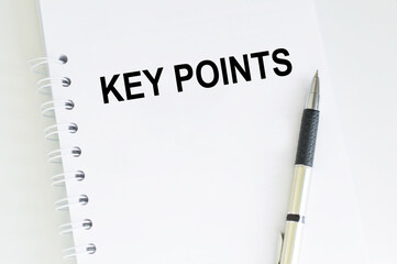 text KEY POINTS on short note texture background with pen