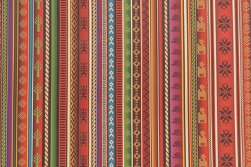 Close up to traditional Peru colorful fabric pattern, unique Peruvian hand made style.
