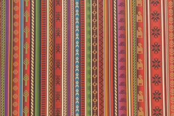 Close up to traditional Peru colorful fabric pattern, unique Peruvian hand made style.