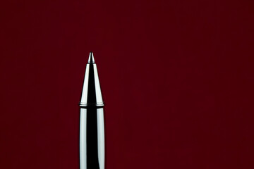 Upright Roller Ball Pen on a Red Background