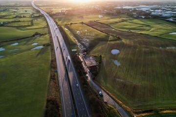 sunrise motorway highway countryside greenery british countryside aerial drone above view