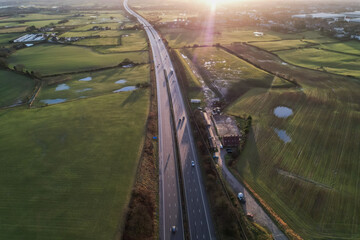 sunrise motorway highway countryside greenery british countryside aerial drone above view