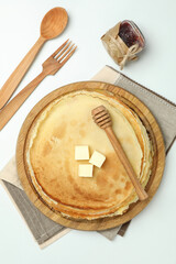 Concept of tasty food with crepes on white background