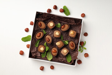 Concept of sweets with chocolate candies on white background