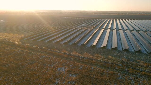 Close up drone view of solar panels stand in a row in the fields power ecology innovation nature environment green energy landscape electrical power ecology innovation nature environment