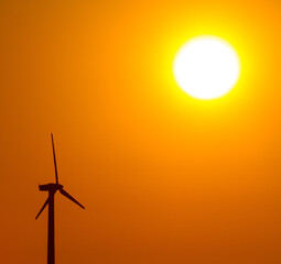 wind energy - silhouette at sunset