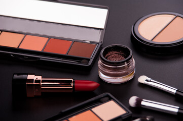 cosmetic products on a black background

