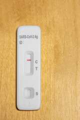Negative covid-19 auto test with one red line appearing on the test cassette