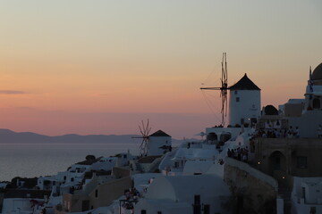 Iconic Windmills of Oia, Santorini, in Sunset, Greece
