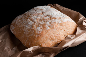 Ciabatta on a black background, Italian ciabatta bread