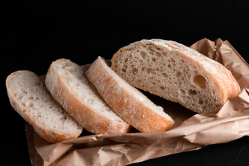 Ciabatta on a black background, Italian ciabatta bread