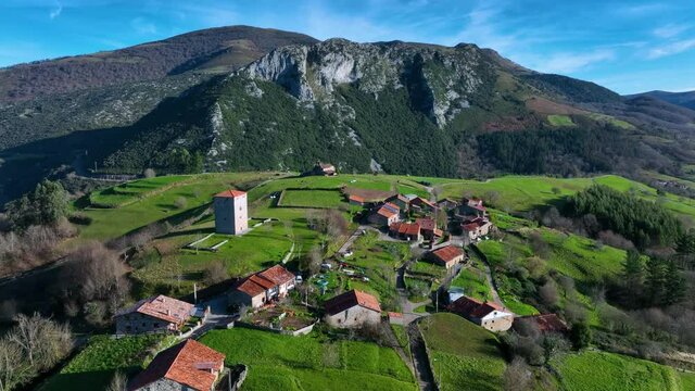Aerial view of the Tower of Rubin de Celis and the church of San Facundo in the Town of Obeso in the Municipality of Rionansa. Cantabria, Spain, Europe