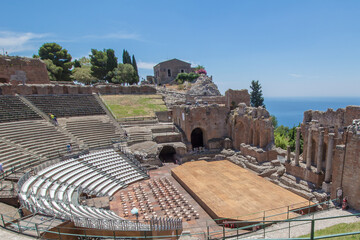 Tourists at the Theatre of Taormina in Sicily.