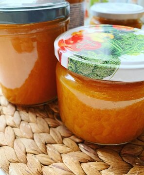 jars with apricot jam, orange color of apricot marmalade, preserves in jars, natural products, homemade jam