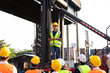 Hispanic man worker protest leader speaking with protester in workplace factory. Activist and leader