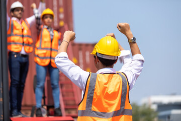 Strike of workers in container yard. Group of multiethnic engineer people during a protest in workplace