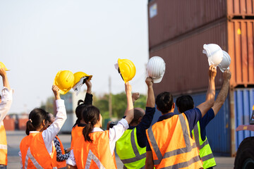 Strike of workers in container yard. Group of multiethnic engineer people during a protest in...