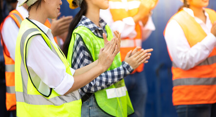 Unity and teamwork concept. Container worker audience applauding in morning brief meeting before going to work. Congratulation Celebrate success concept.