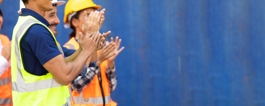Unity and teamwork concept. Container worker audience applauding in morning brief meeting before going to work. Congratulation Celebrate success concept.