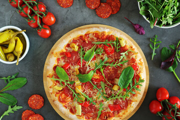 Pizza diavolo flat lay with pepper	