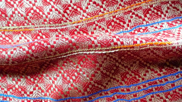 4K More than 60 years old colorful thai slik handcraft peruvian style rug surface old vintage torn conservation Made from natural materials Chemical free close up