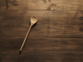 Wooden spoon on wooden table