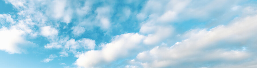 Wide summer cloudscape, partially cloudy blue skylight, fluffy clouds