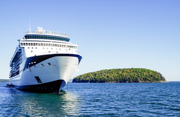 Celebrity cruiseship cruise ship liner Summit Millennium Infinity Constellation in bay with island...