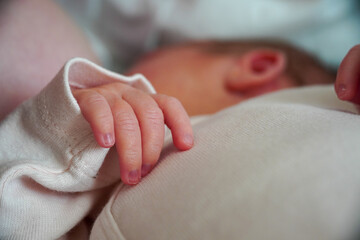 Fingers on the hand with the nails of a newborn baby. close up view macro closeup. High quality photo