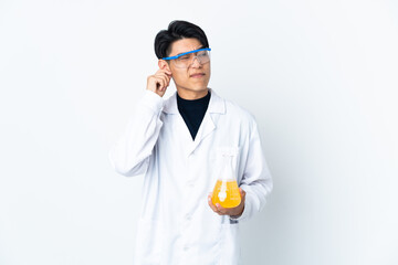 Young Chinese scientific man isolated on white background frustrated and covering ears