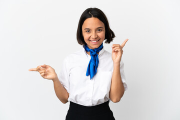 Airplane stewardess over isolated background pointing finger to the laterals and happy